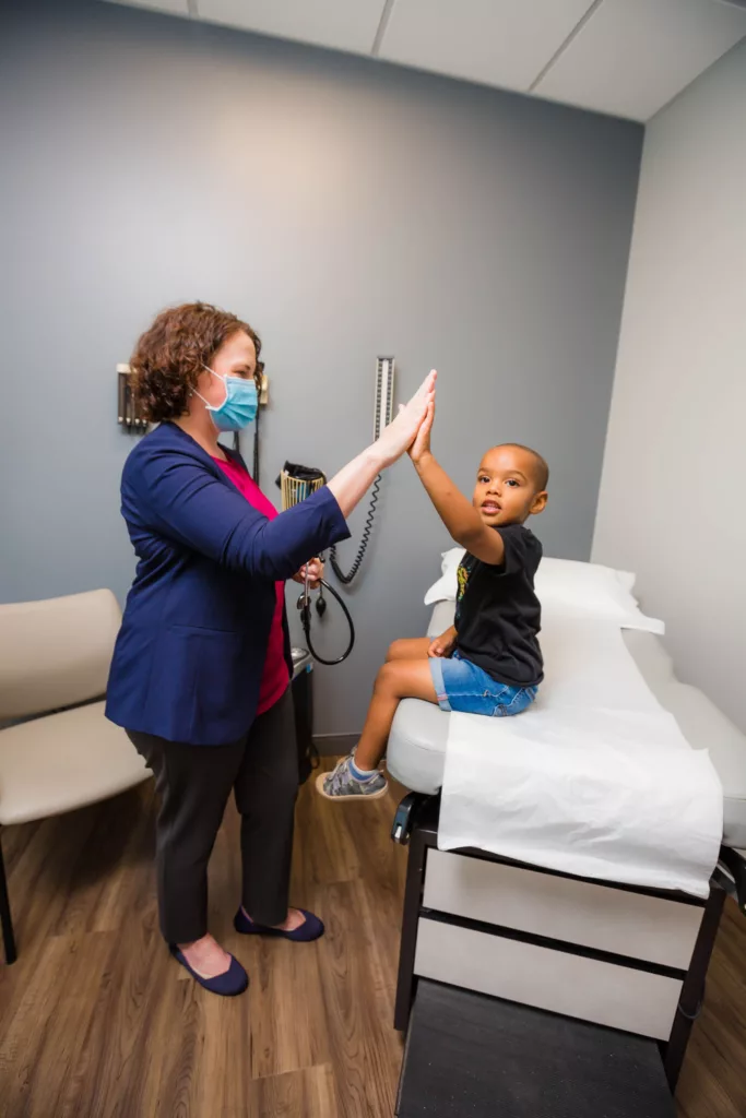 Arlington pediatric practitioner with patient